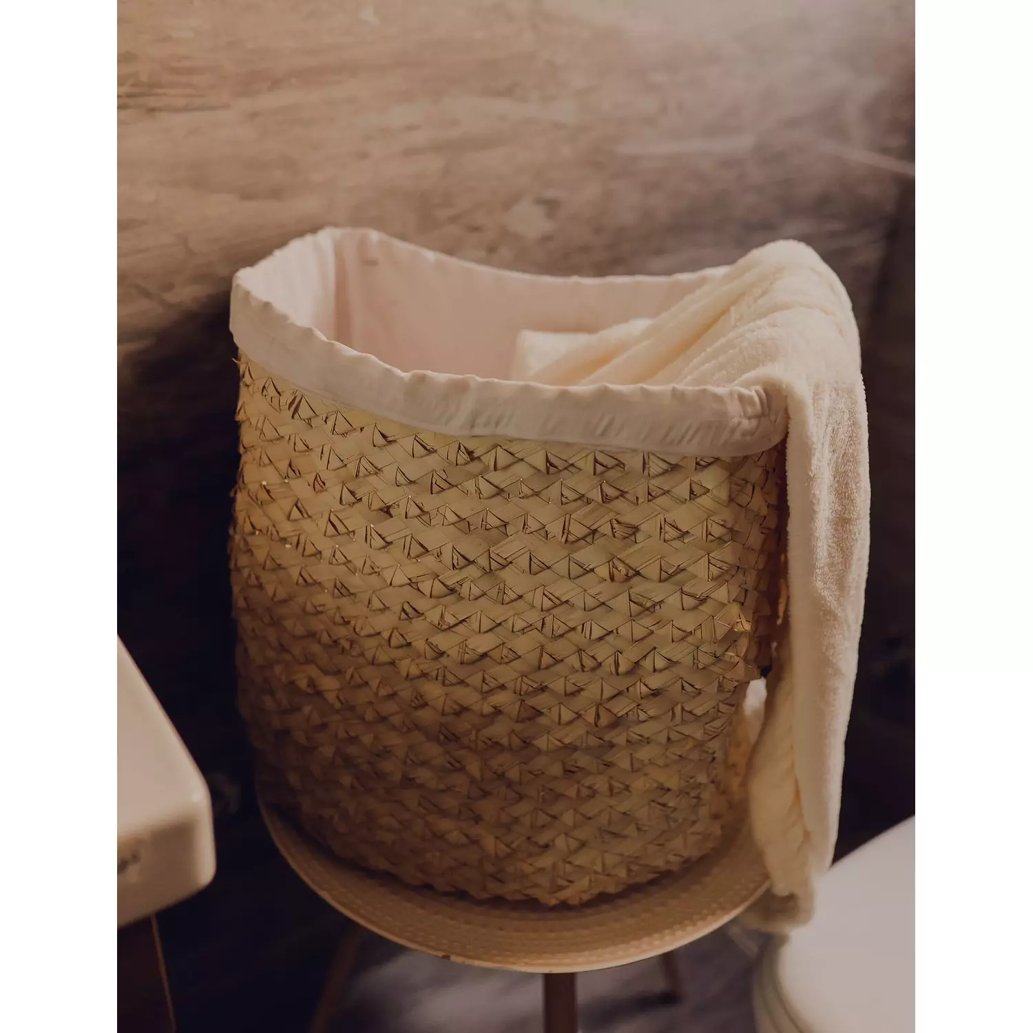Straw laundry basket with fabric hover image