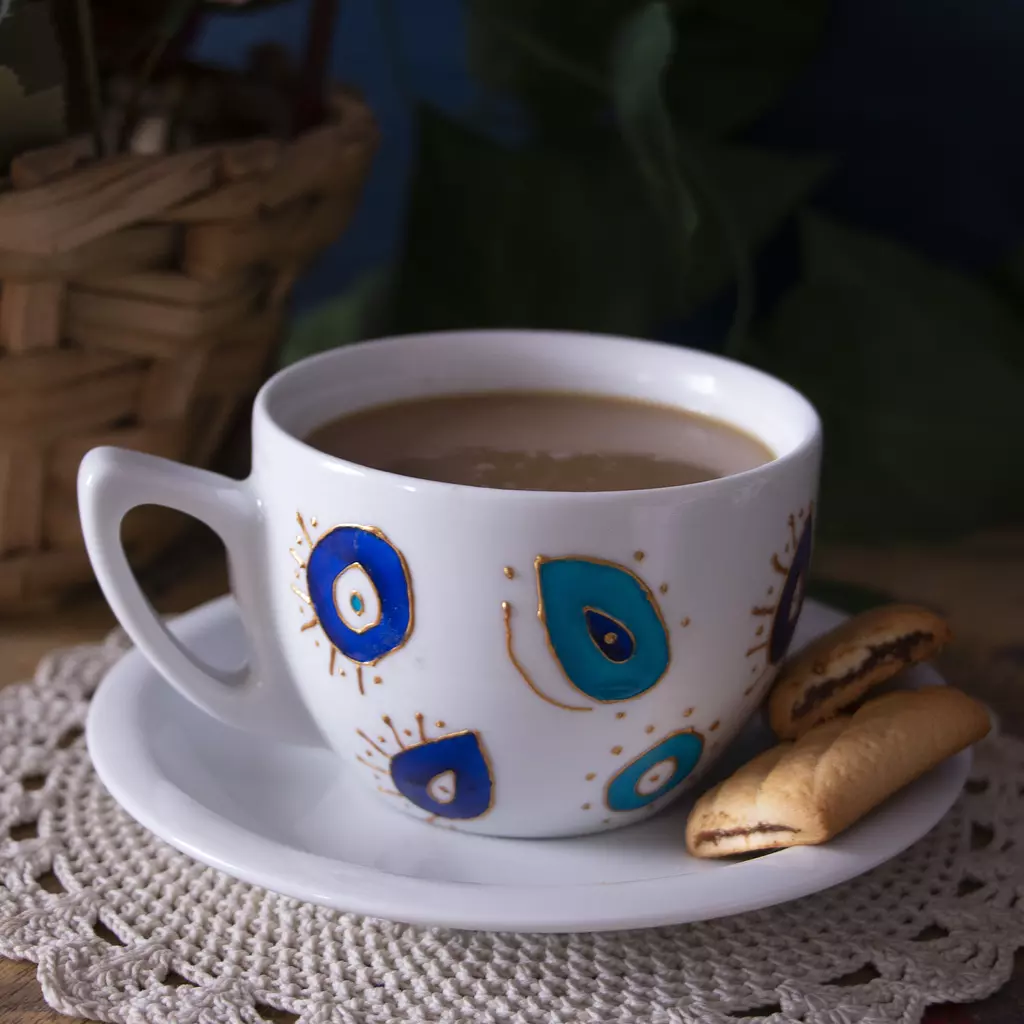 Blue eyes cappuccino and teacup