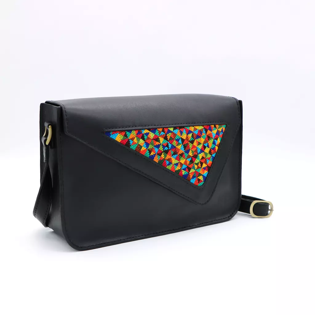 Genuine leather bag with colorful cross-stitching.