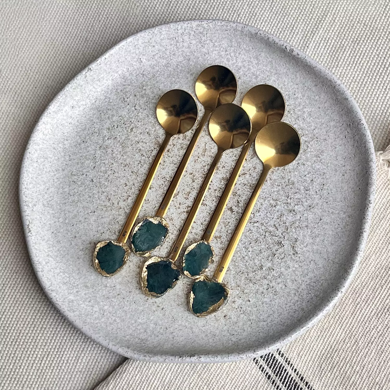 Gold teaspoons set hover image