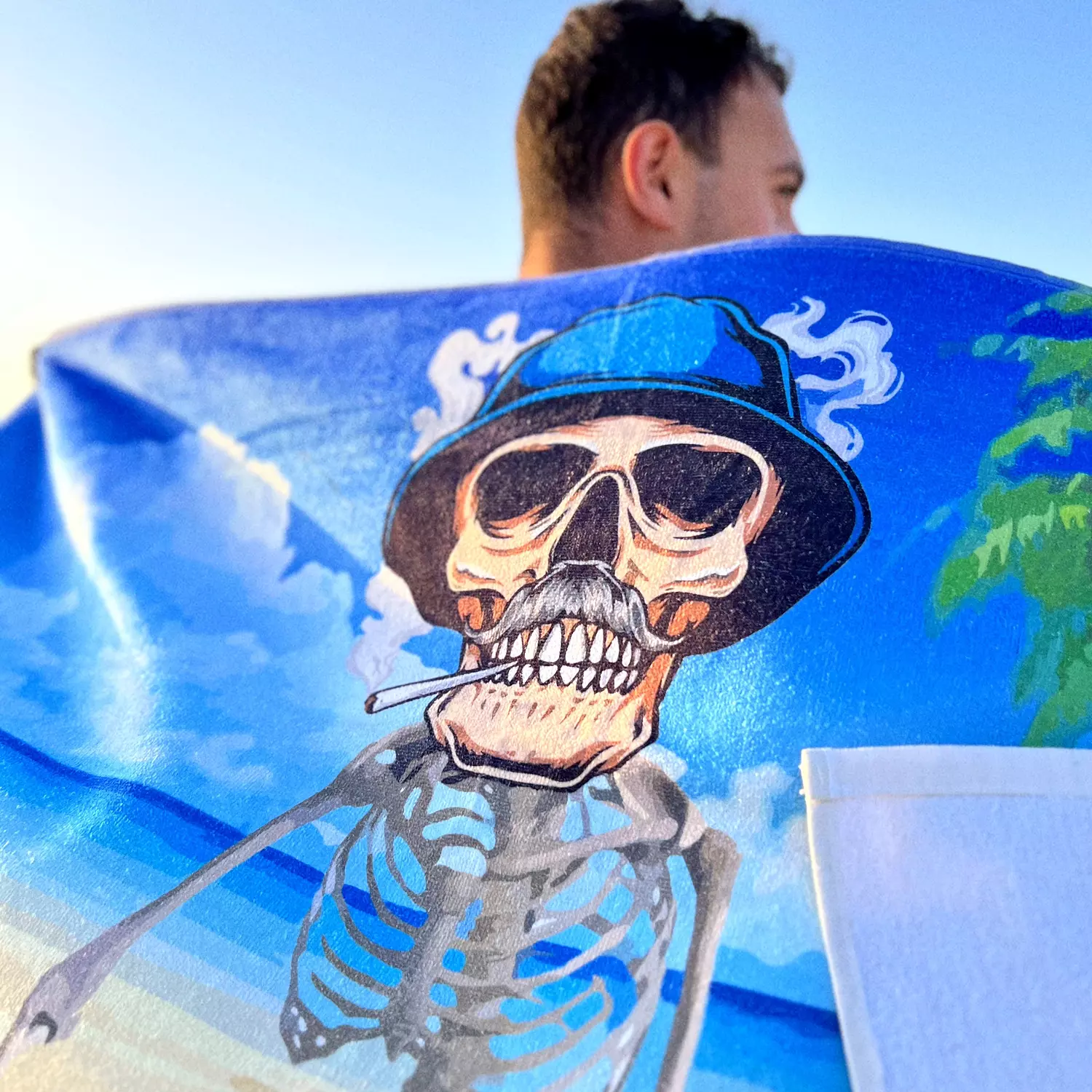 Smoking Skull Beach Towel hover image
