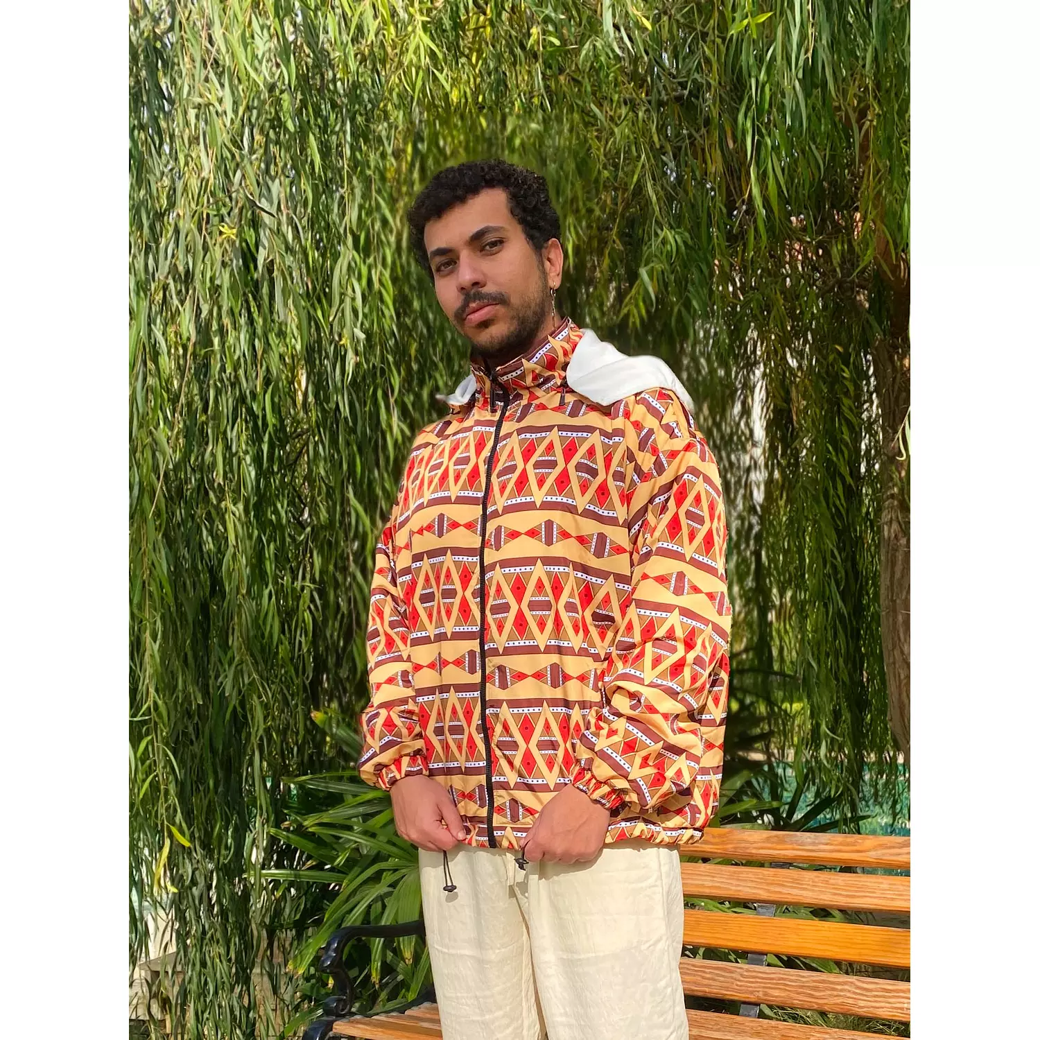 Ethnic Ochre and Orange Unisex Hooded Bomber Jacket hover image