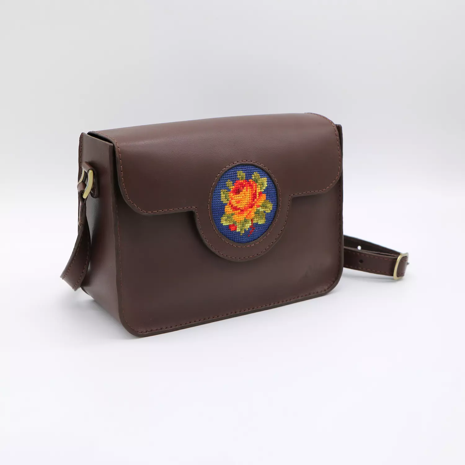   Genuine leather bag with floral design. 1
