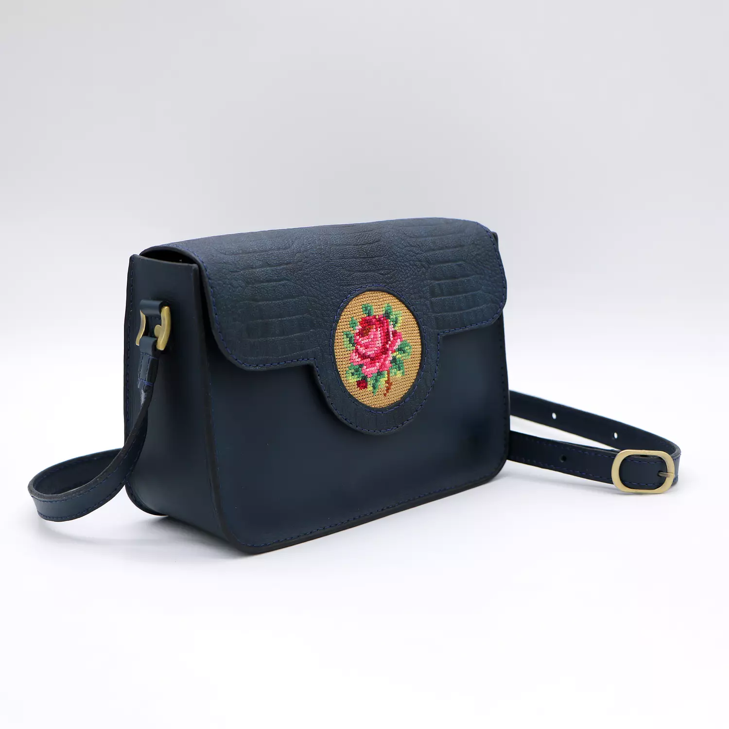 Genuine leather bag with floral design. 1