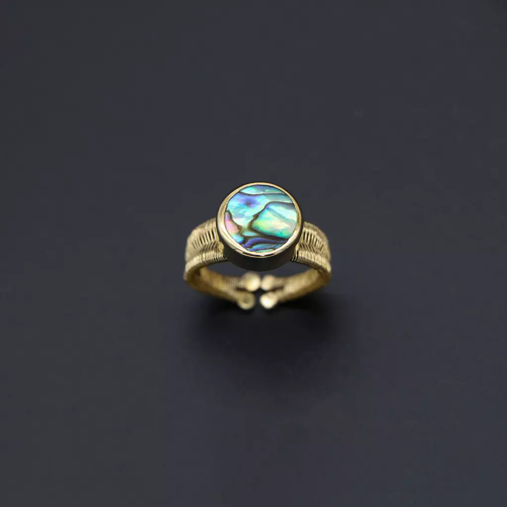 Brass ring with abalone shell.