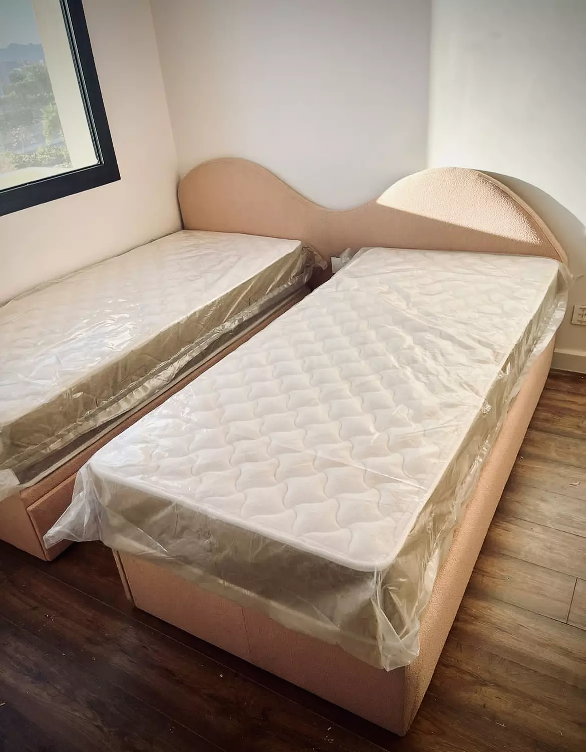 Two Beds with A Headboard hover image