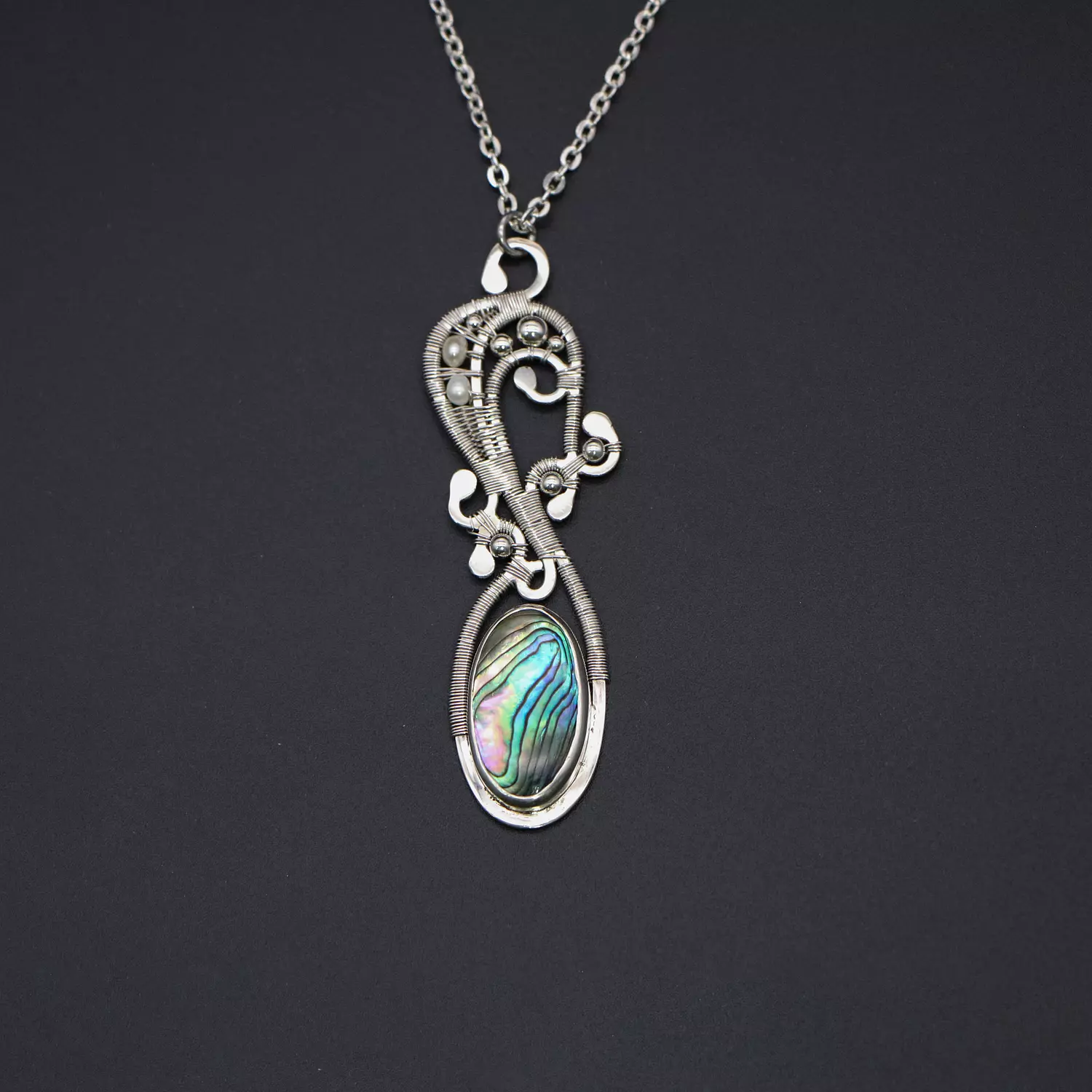 Silver necklace with abalone shell, pearls and silver balls. hover image