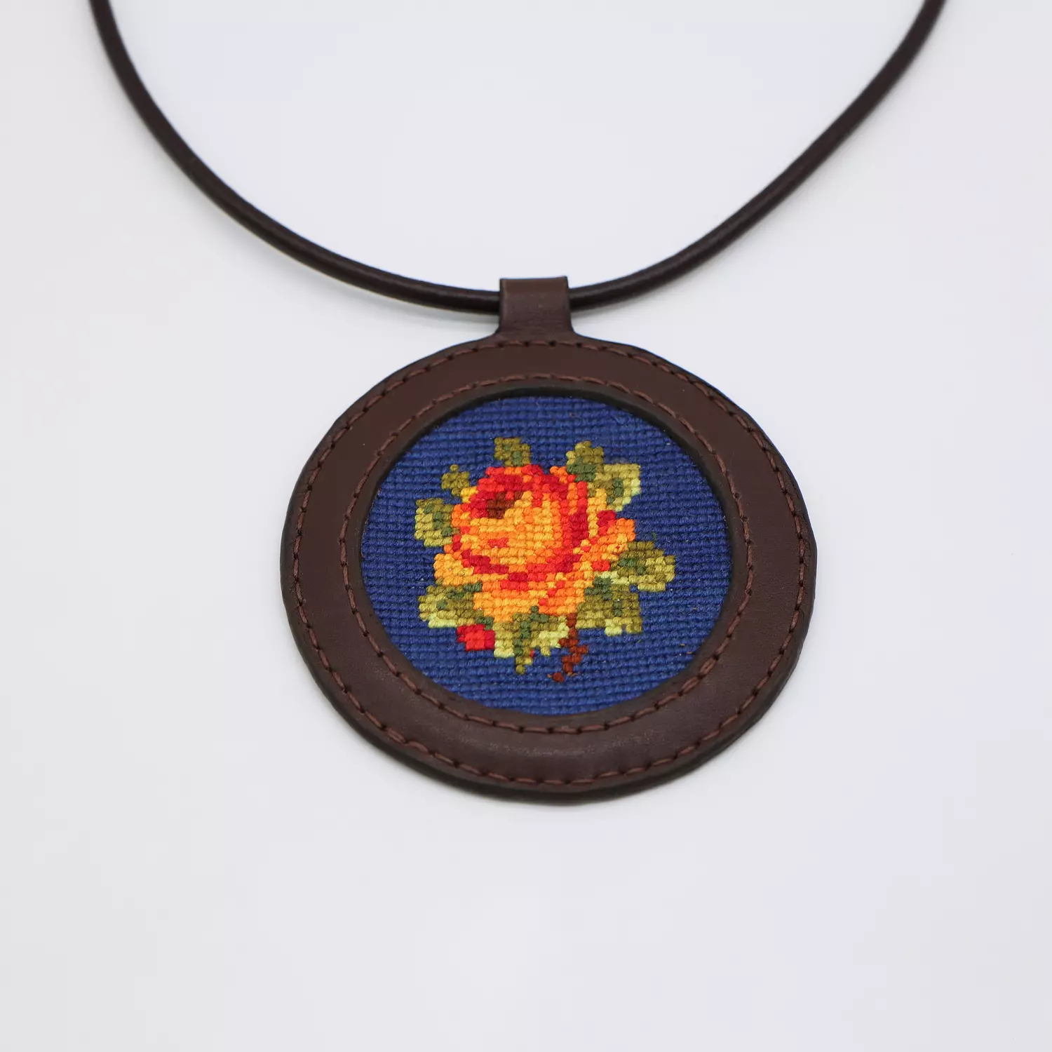 Genuine leather necklace with floral Cross-stitching hover image