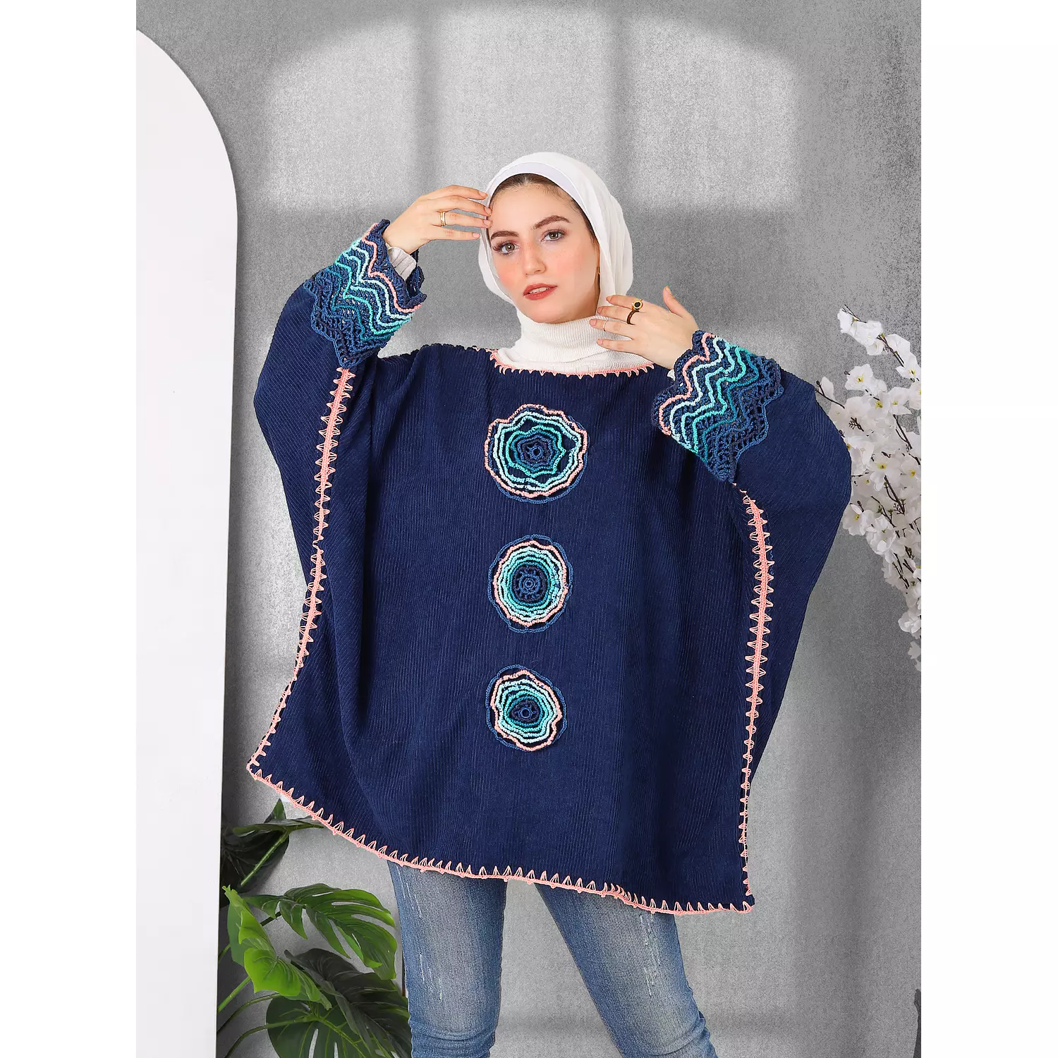 Close Poncho with handmade touch. hover image