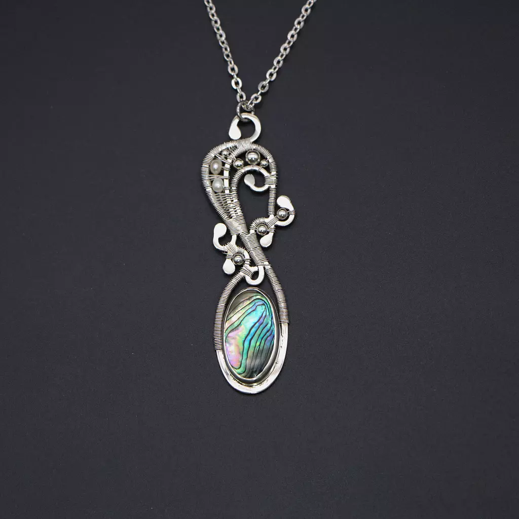 Silver necklace with abalone shell, pearls and silver balls.