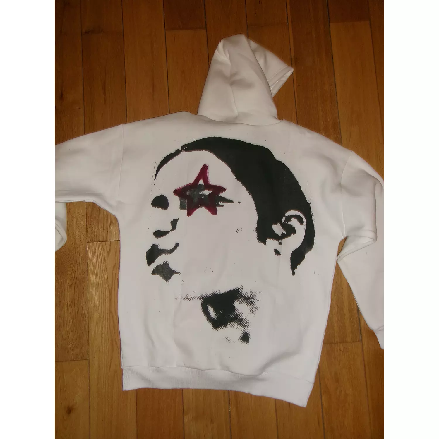 broken glass star in burgundy hoodie hover image