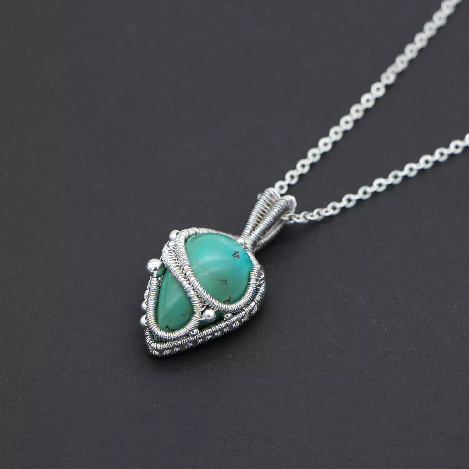 Pendant with turquoise gemstone. hover image
