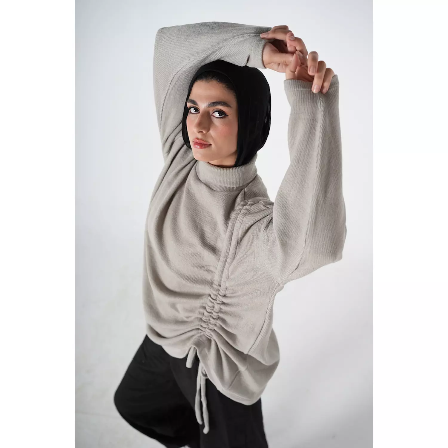 The curved side pullover in grey  hover image