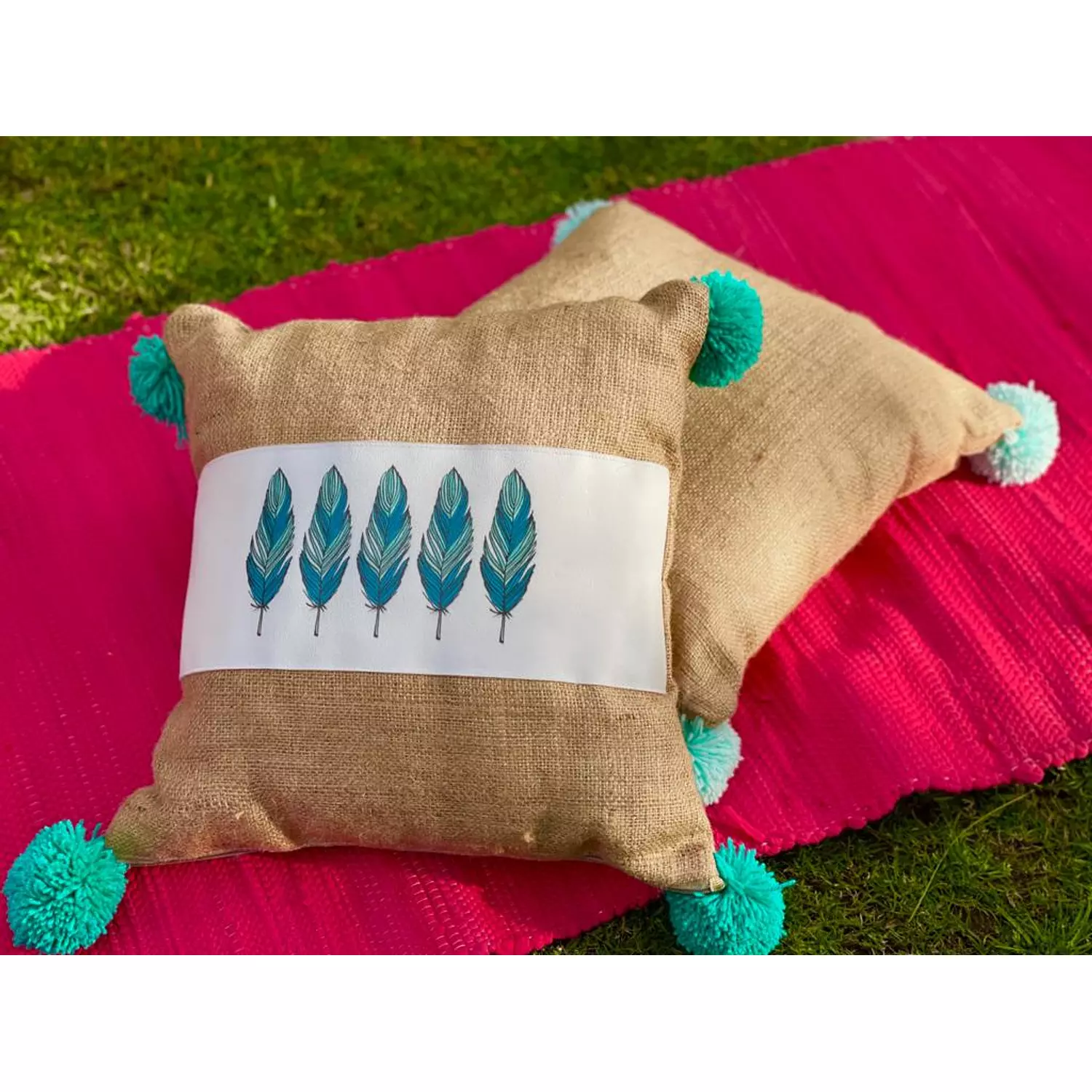 The Burlap Feather Cushion Turquoise Pompoms 2