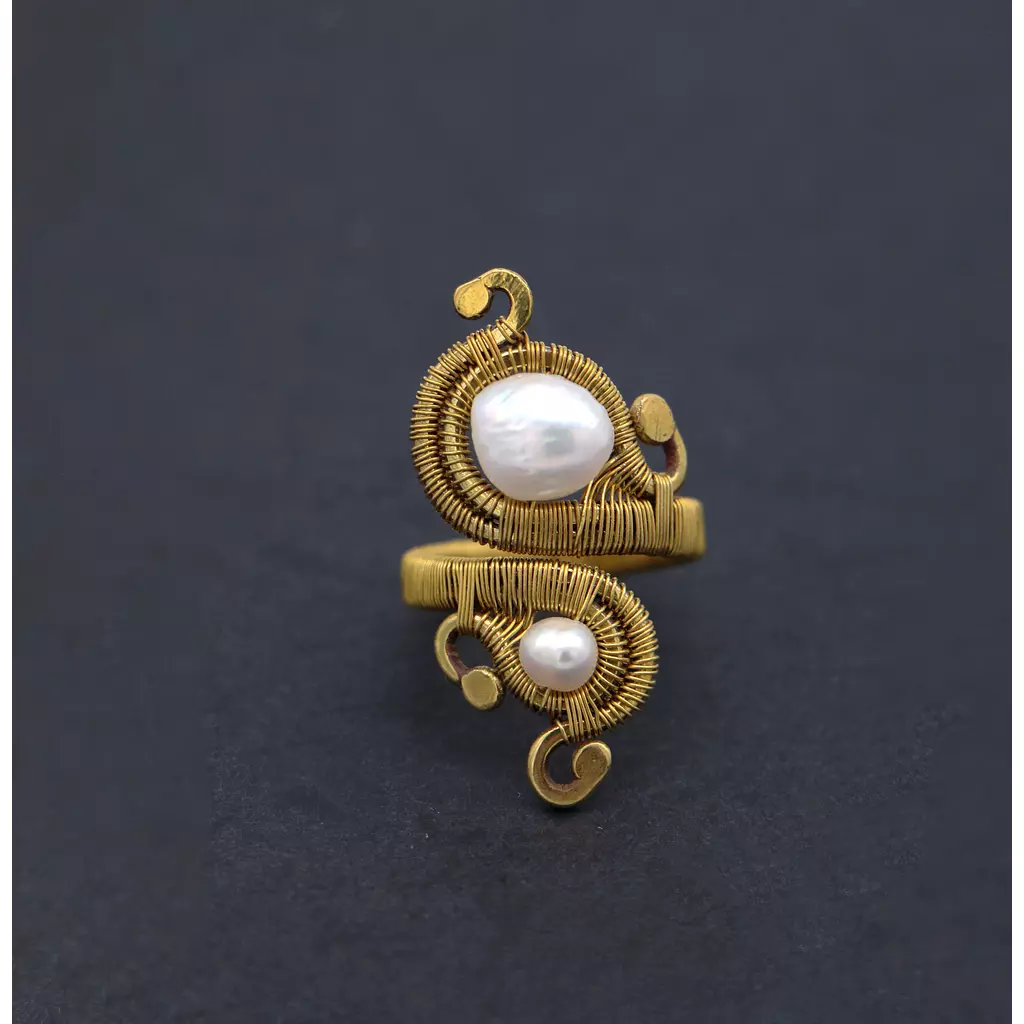 Brass ring with pearls.