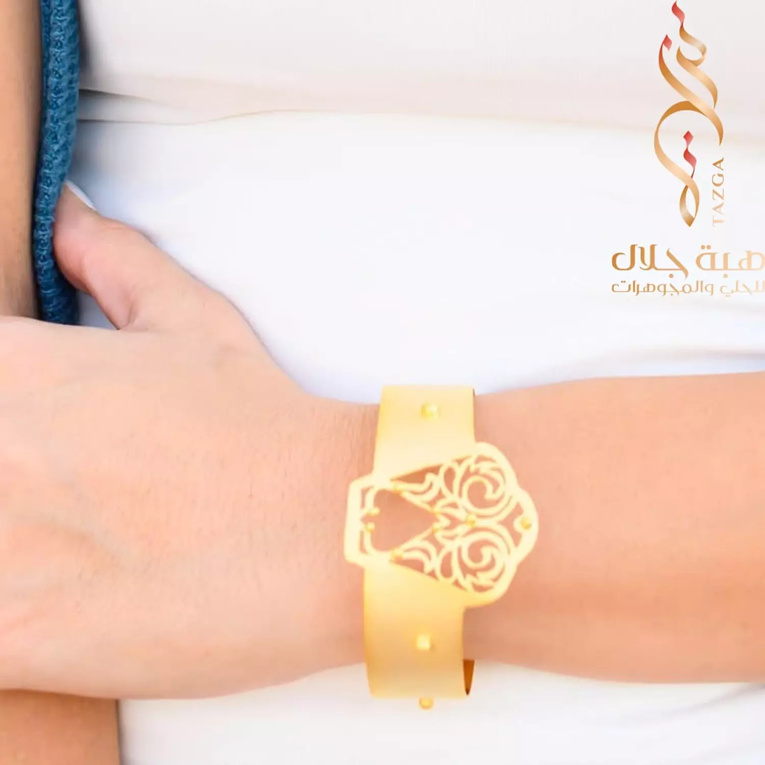 A distinctive design bracelet coated in gold. hover image