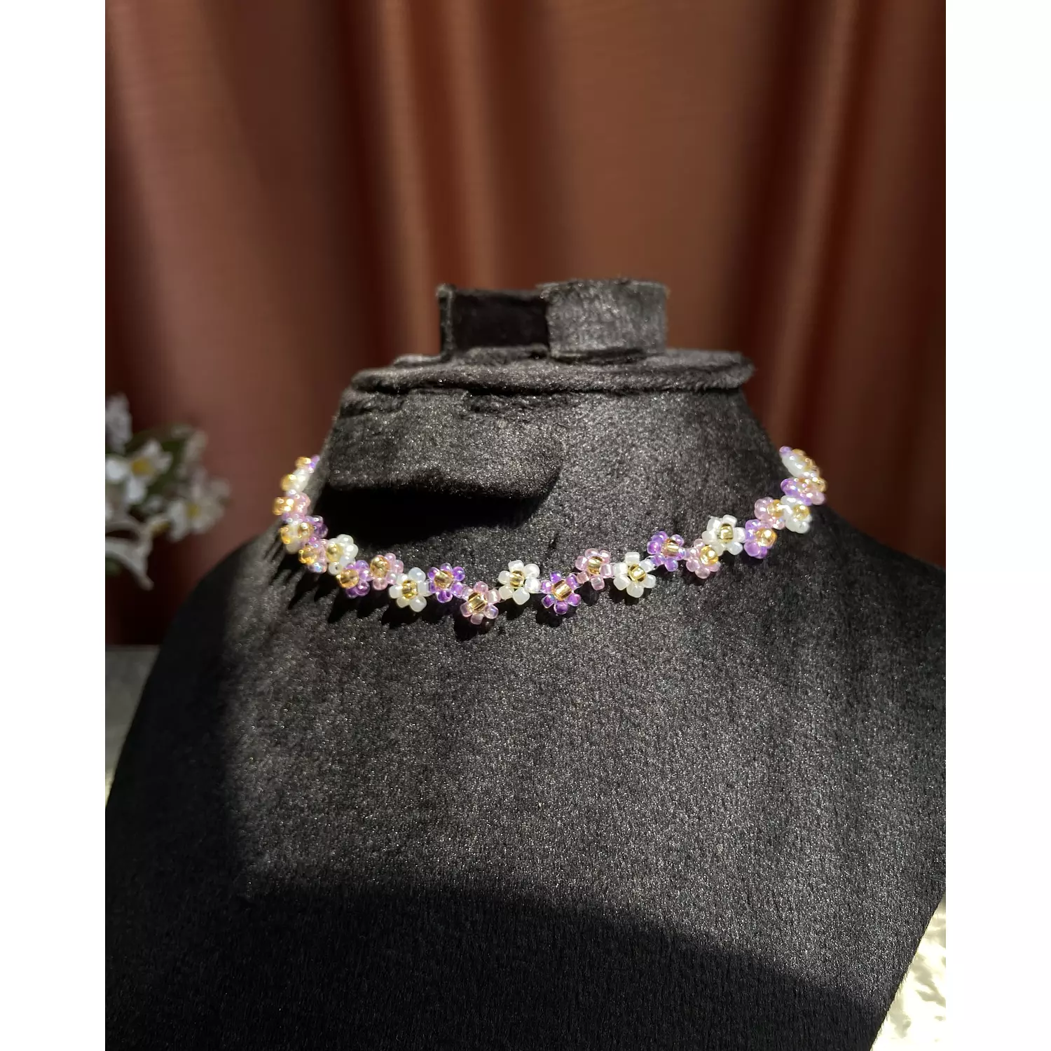 Purple shades with white flowers necklace  hover image