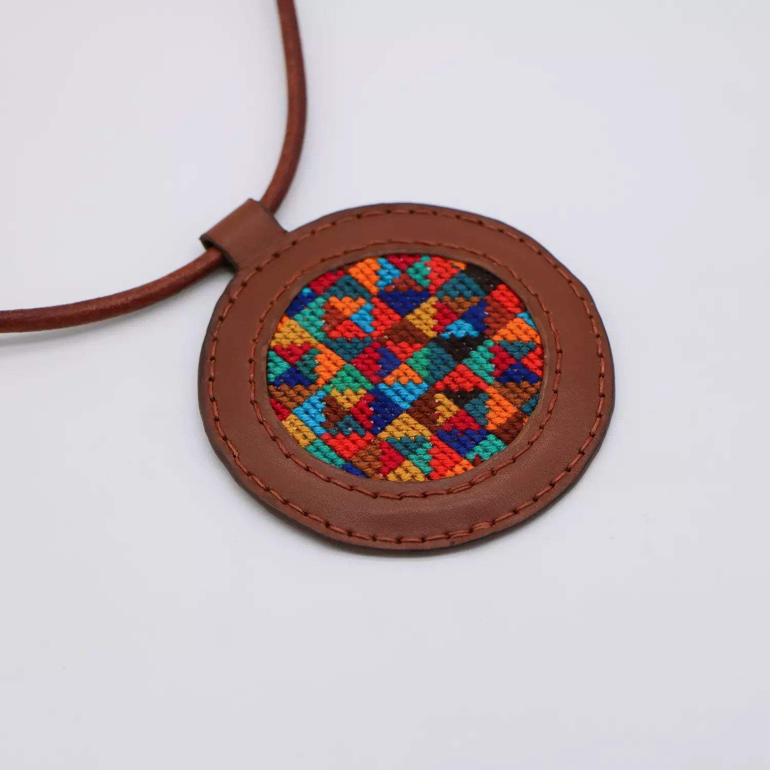 Genuine leather necklace with colorful Cross-stitching. hover image