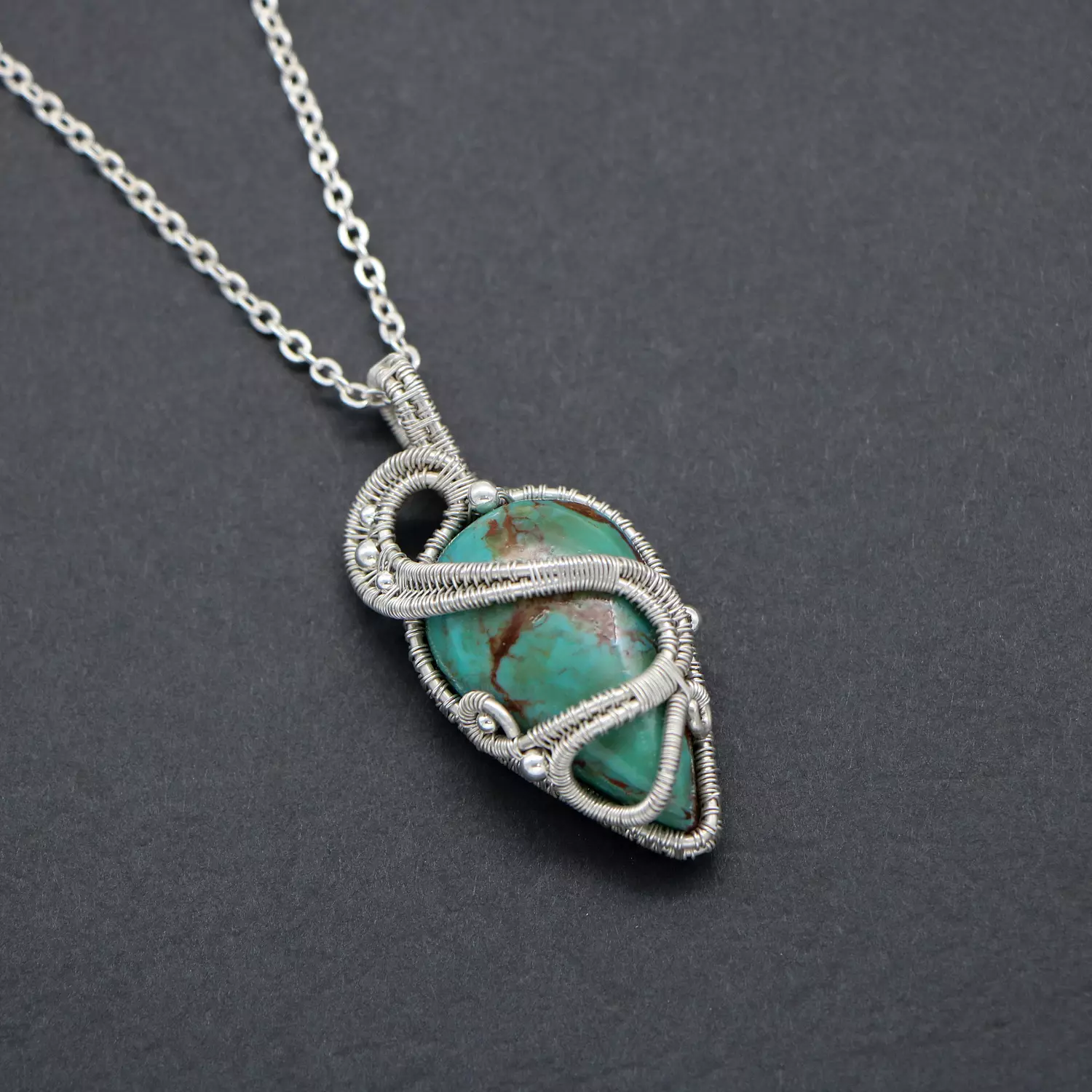 Pendant with turquoise gemstone. hover image