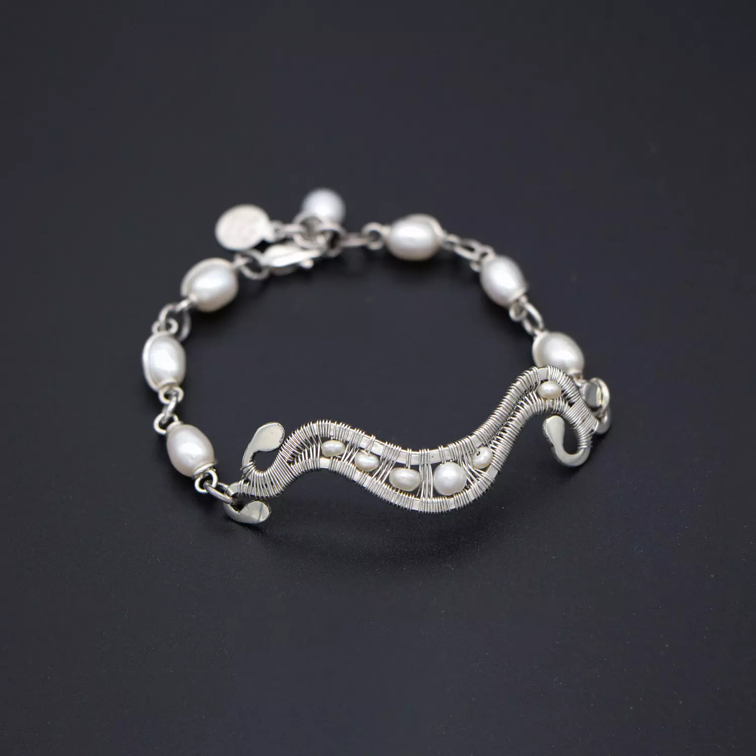 Silver bracelet with pearls. hover image