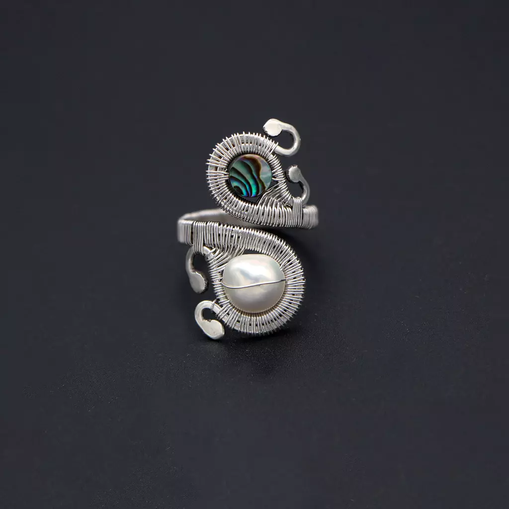 Long silver ring with abalone shell and pearl.