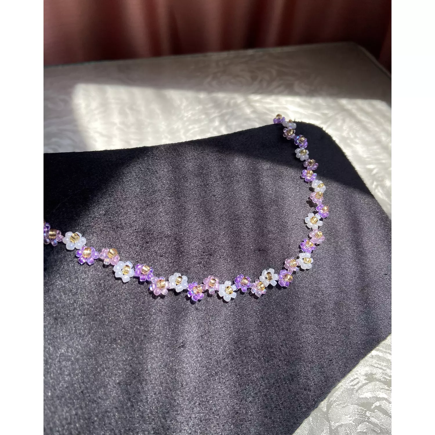 Purple shades with white flowers necklace  1