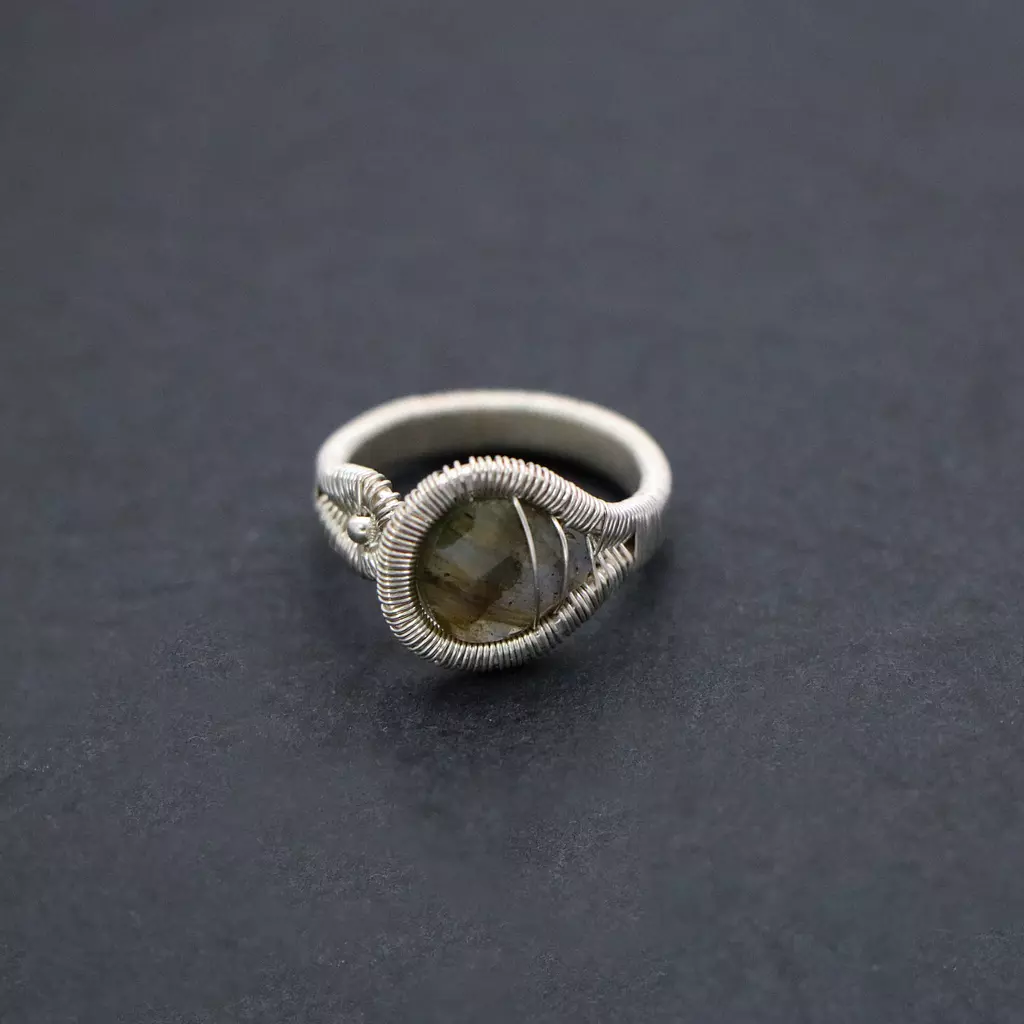 Wire wrapped ring with labradorite gemstone.