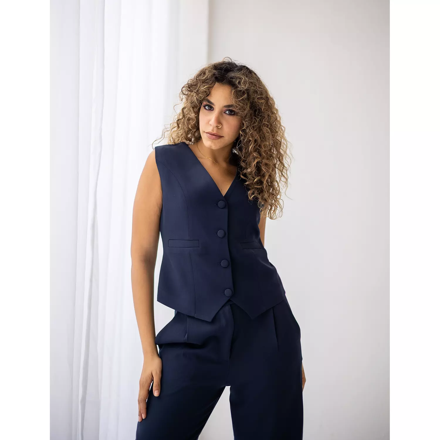 Navy blue cropped vest  hover image