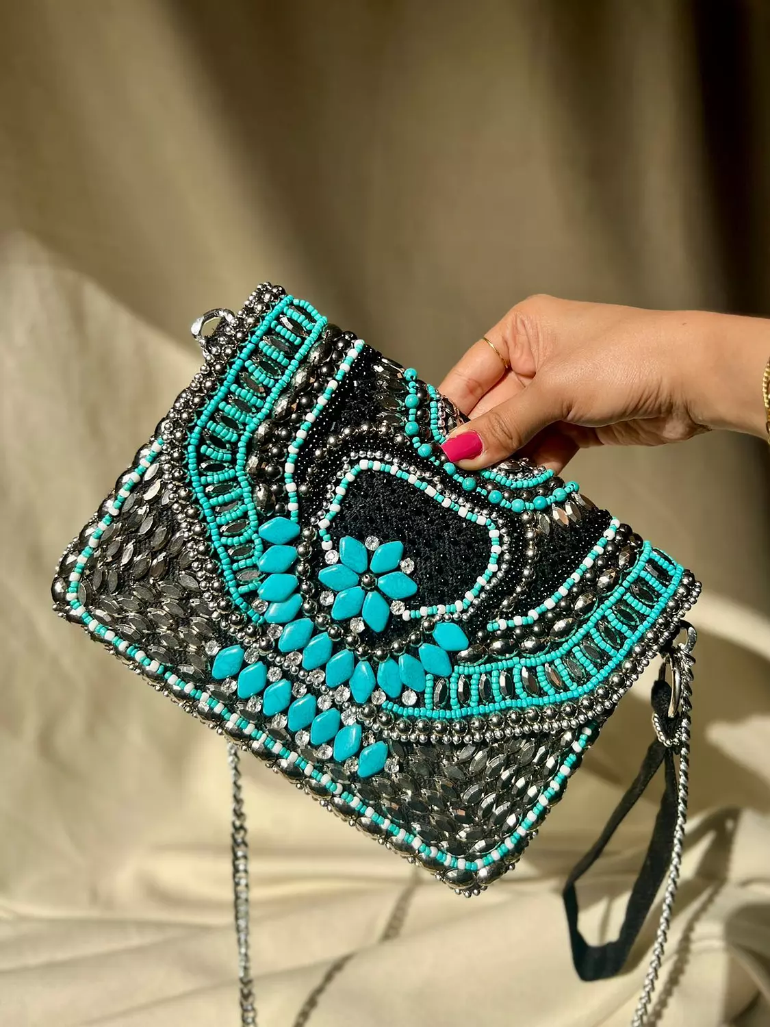 Black bag with turquoise stones hover image