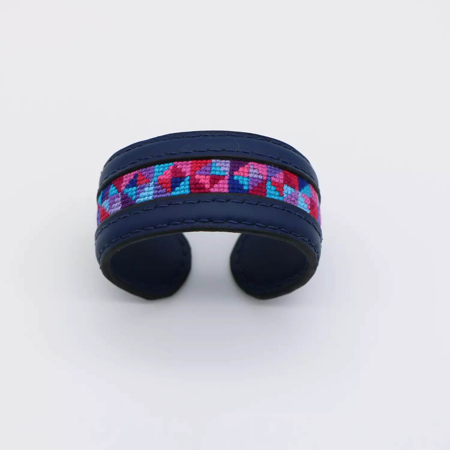 Dark blue genuine leather cuff with colorful Cross-stitching hover image