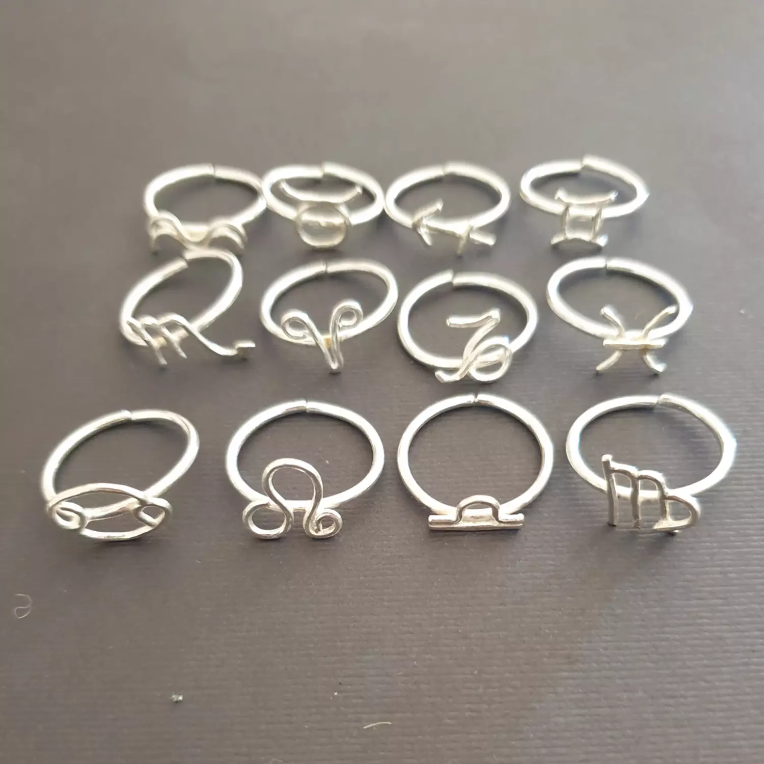 Zodiac wire rings hover image